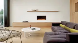 Home remodel with a gas burning fireplace insert with a stylized mantel and a storage bench underneath it.
