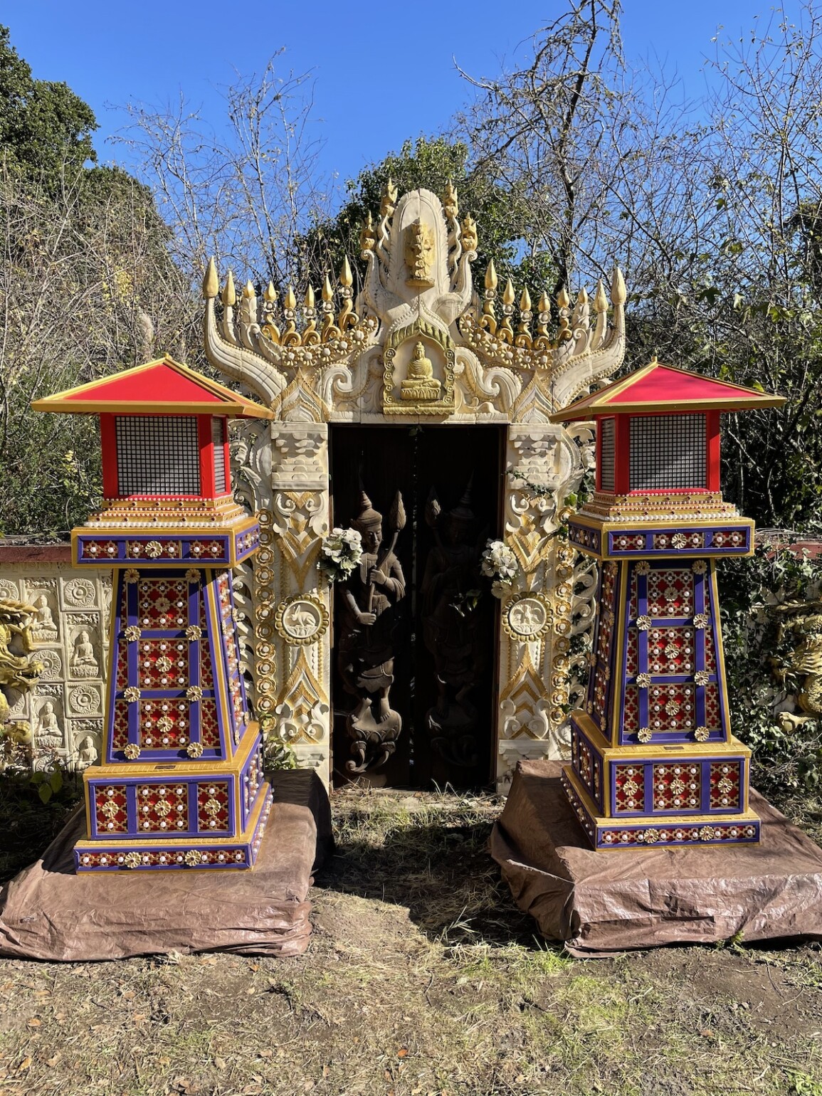 Jaap van Leeuwen's lanterns in front of the concrete Myanmar Buddhist monastery gateway that he made in Bolinas