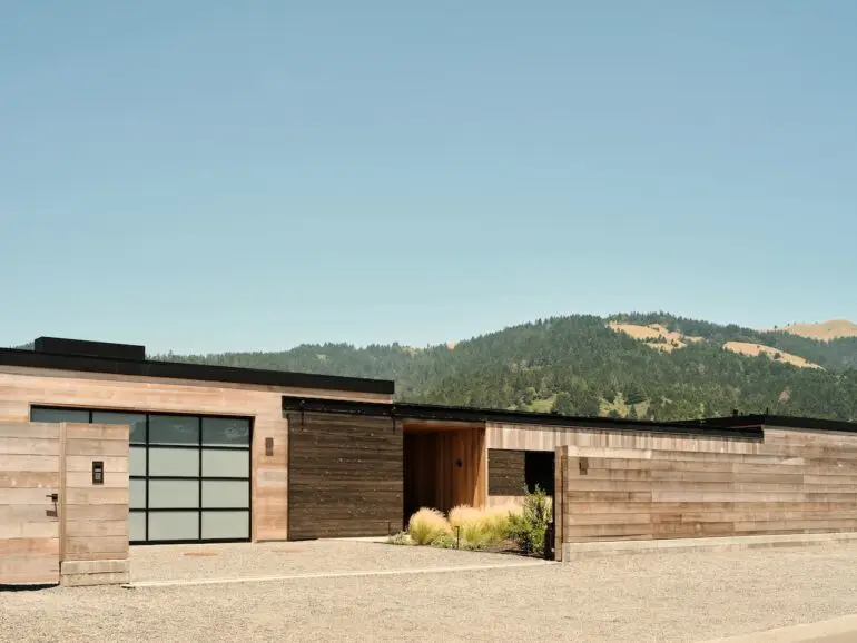 Beyond the understated façade of this home lies stunning views of the Bolinas Lagoon and coastal range.