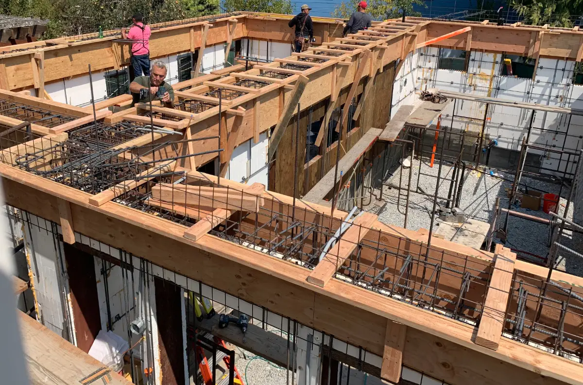 Nick Calder and his team assembling the framework and rebar for the concrete walls of their ADU during construction.