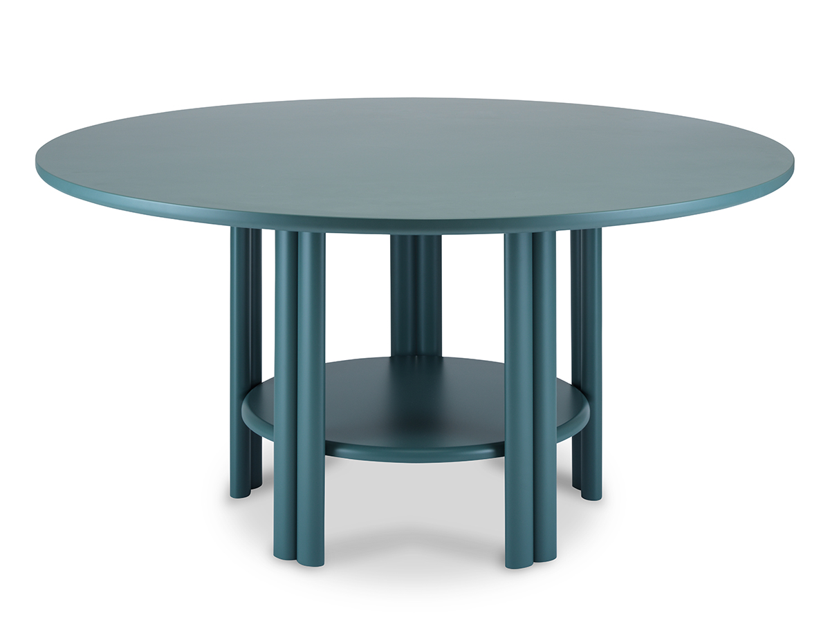 A circular table featuring a green surface