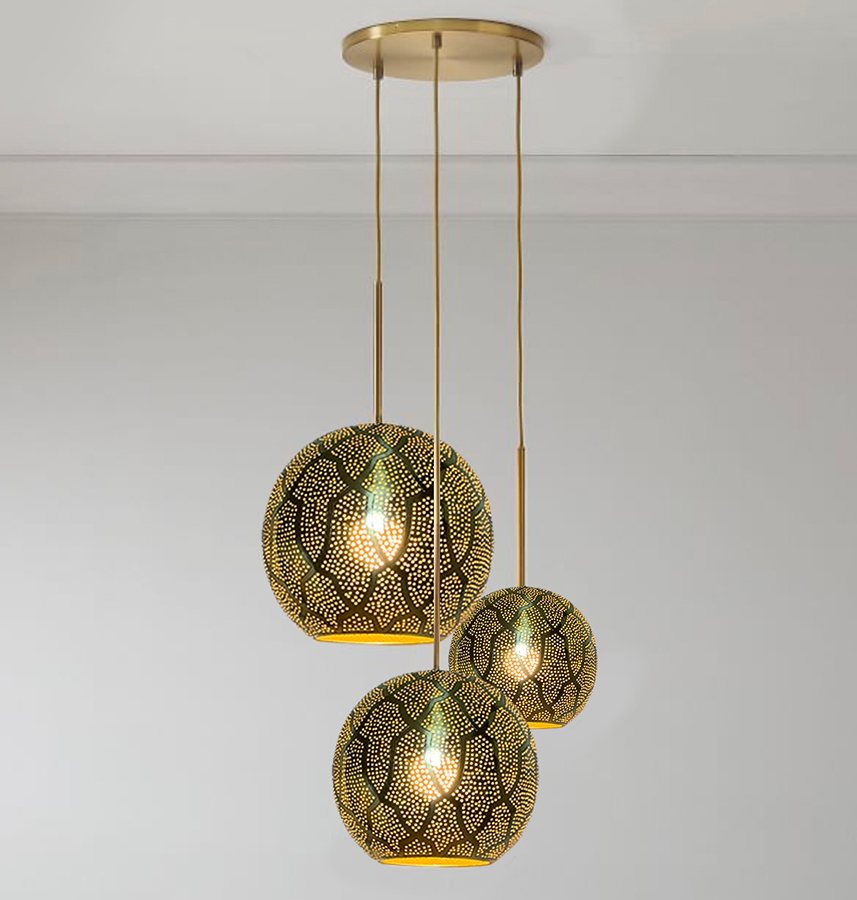 Three hanging lamps featuring elegant gold and black designs, suspended from the ceiling in a stylish arrangement.