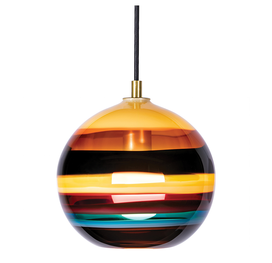 A vibrant, multi-colored glass ball pendant light hanging from the ceiling, casting colorful reflections.