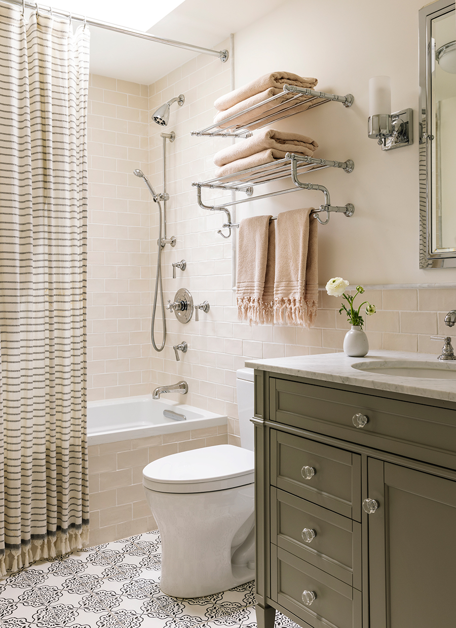 A modern bathroom layout including a shower, toilet, sink, and towel rack, emphasizing practicality and style.