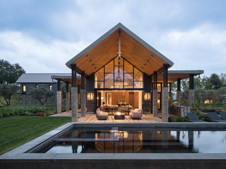 A contemporary home featuring a swimming pool and a spacious patio area for outdoor relaxation.