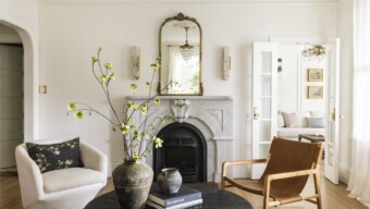 A Carrara marble fireplace surround adds an elegant, classic touch to the living room.