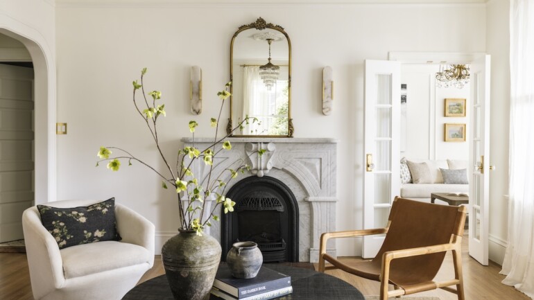 A Carrara marble fireplace surround adds an elegant, classic touch to the living room.