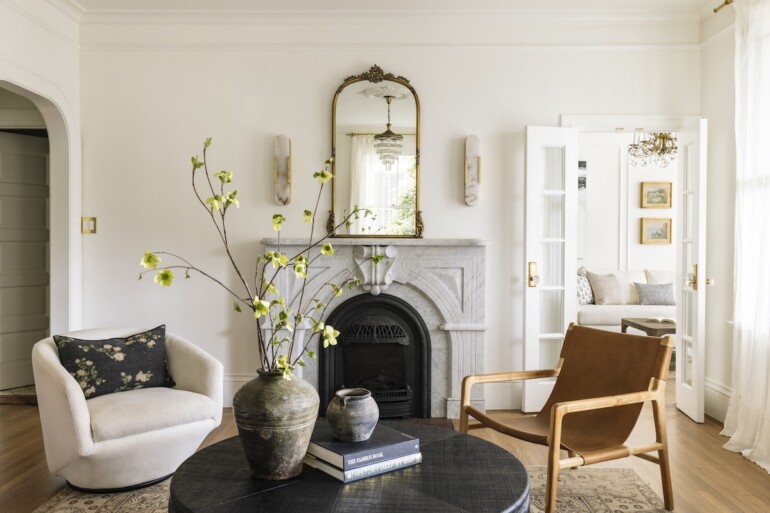 A Carrara marble fireplace surround adds an elegant, classic touch to the living room.