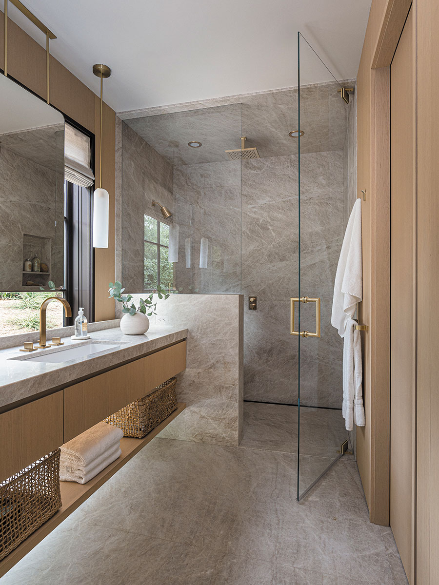 A bathroom is awash in oak and Taj Mahal quartzite