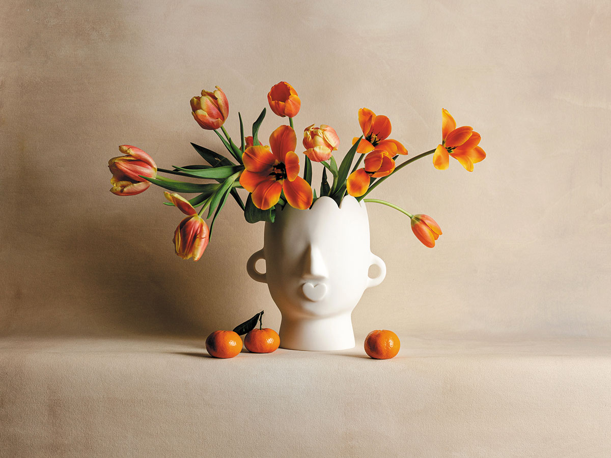 A feminine white vase of tulips