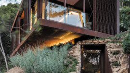 A modern ADU showcasing a combination of stone and wood materials in its design.