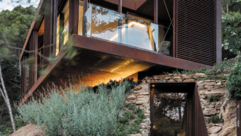 A modern ADU showcasing a combination of stone and wood materials in its design.