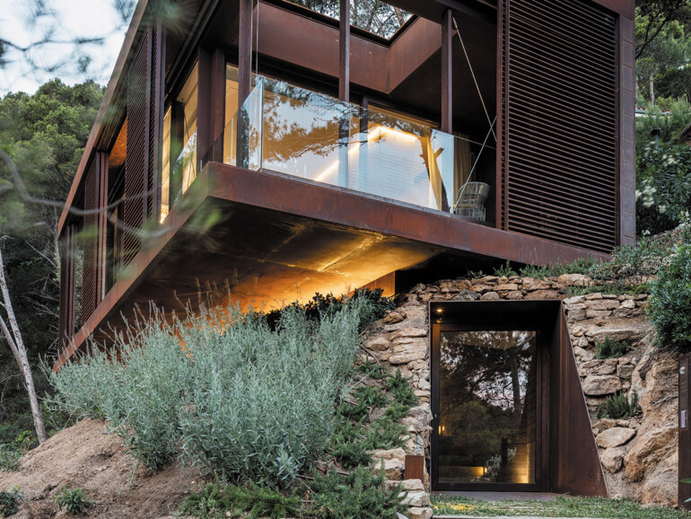 A modern ADU showcasing a combination of stone and wood materials in its design.