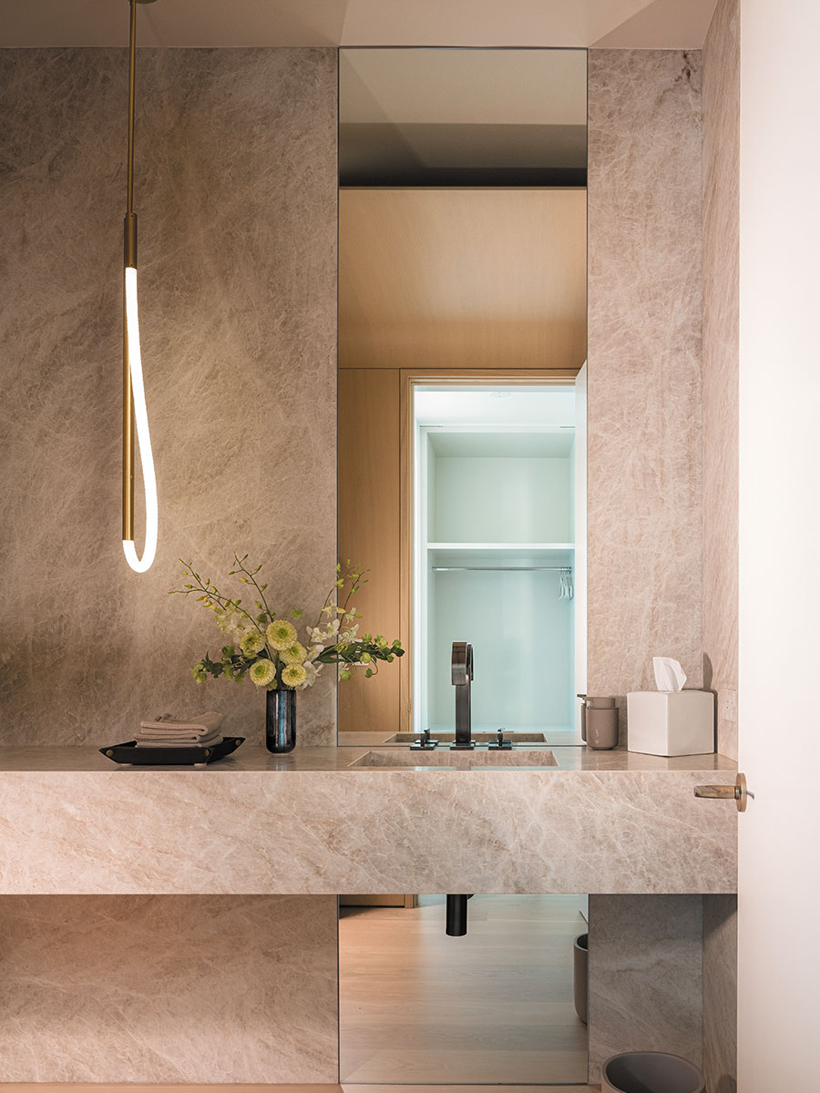 A powder room includes a Luke Lamp Co. pendant