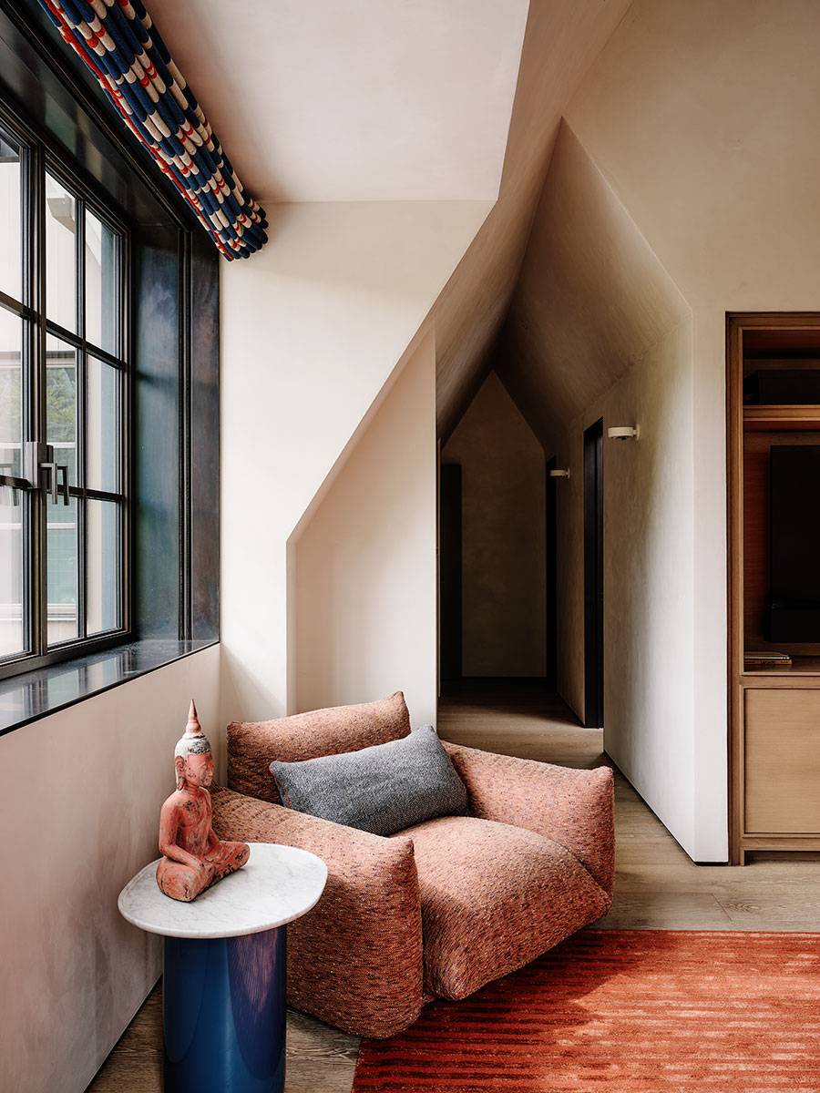 A cozy living room featuring a comfortable couch and a stylish table, creating a welcoming atmosphere.