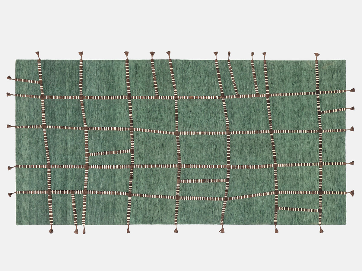 A green rug featuring a square pattern, showcasing a vibrant and modern design suitable for various interior styles.