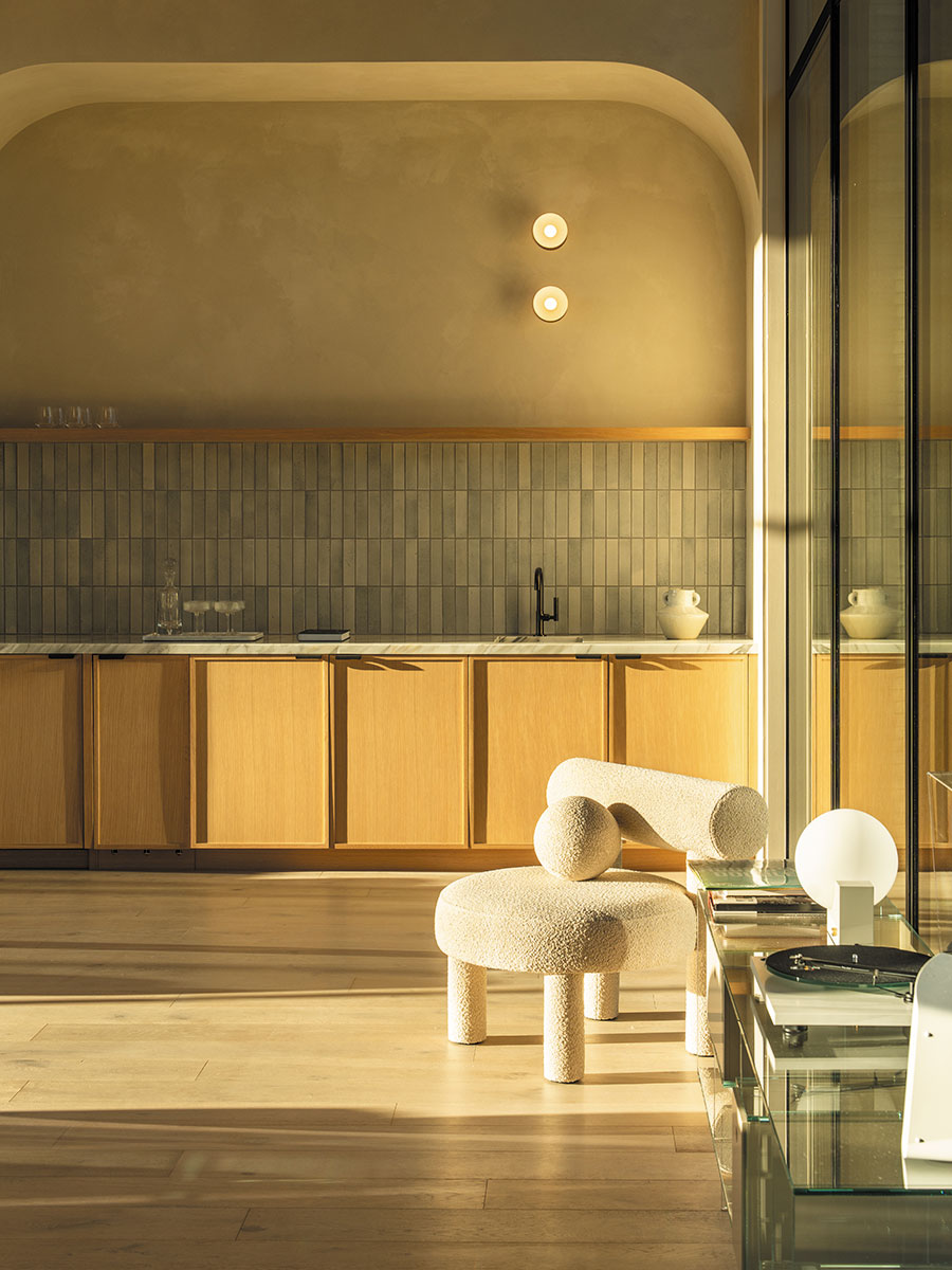A kitchen featuring a wooden table surrounded by four chairs, with cabinets and appliances in the background