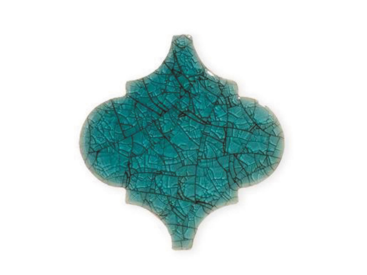 A turquoise tile with a fragmented design, highlighting its unique and artistic imperfections.
