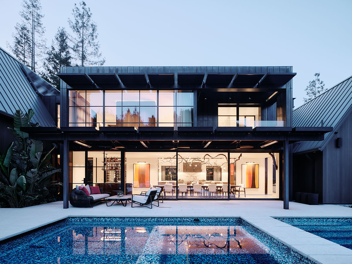 A modern home featuring a sleek pool and a spacious patio for outdoor relaxation and entertainment.