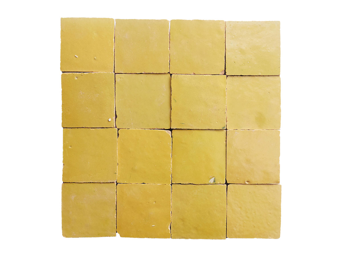 Yellow tiles arranged on a white background, creating a vibrant and contrasting visual pattern.